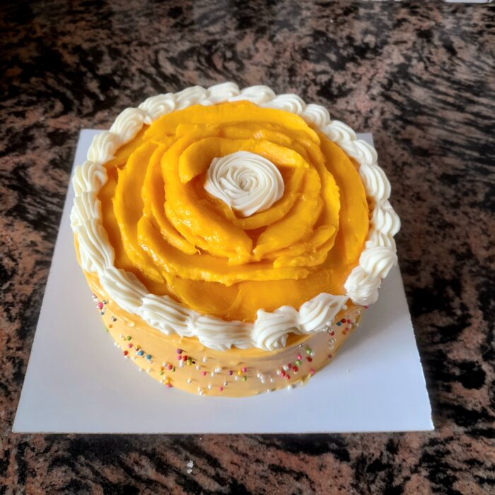Mango cake frosting with mango ganache